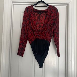 Red and black, long sleeve, animal print body suit.